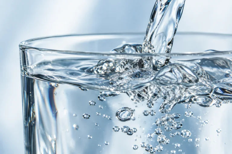 Close-up of water being poured into a glass